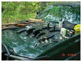 In the summer of 2006 CO Pat MacManus was patrolling the Allegan Game area and heard some shooting. Curious about what might be going on, he stopped and found four boys, 16-14-14-13, with all of these weapons and 3,000 rounds of ammo. They had skipped school for the day to do a little shooting. The boys were all cooperative. The AK-47 had been bought off the street in Grand Rapids for $400, which one of the boys had gotten for Chrismas. All the parents were called and came to fetch their young men, and one might say they were NOT happy with the boys.